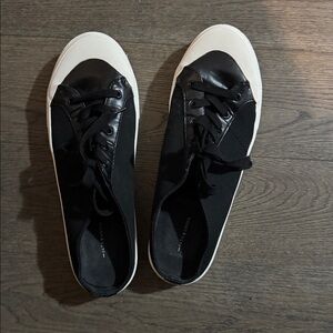 Black 14th & Union brand leather sneakers.
